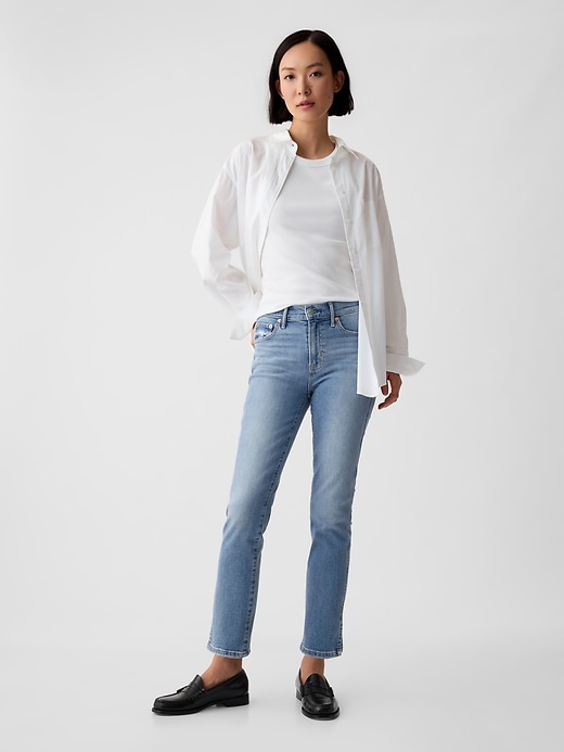 jeans vintage slim a vita media con orlo diviso