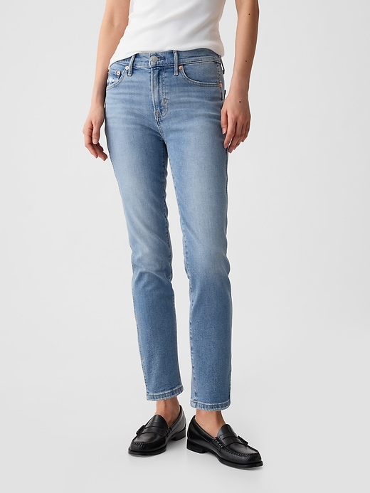 jeans vintage slim a vita media con orlo diviso