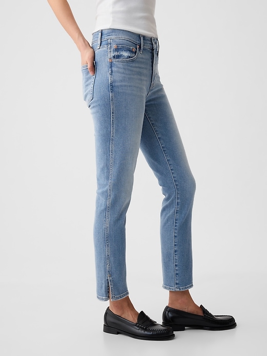 jeans vintage slim a vita media con orlo diviso