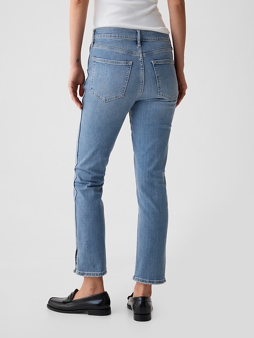 jeans vintage slim a vita media con orlo diviso