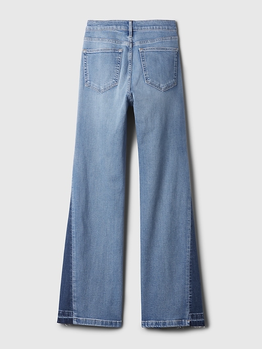 jeans a zampa anni 70 con toppe a vita alta
