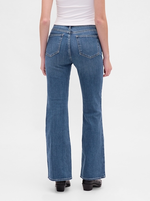 jeans a zampa anni 70 a vita alta