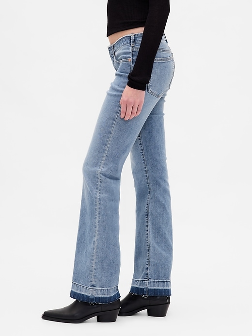 jeans lunghi e attillati a vita bassa