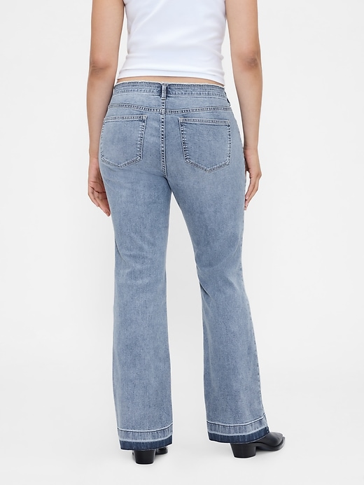 jeans lunghi e attillati a vita bassa