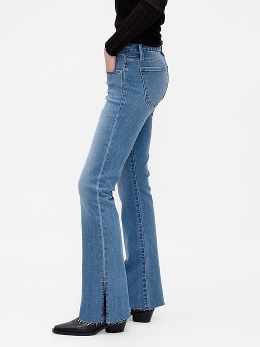 jeans a vita bassa lunghi e attillati con orlo diviso