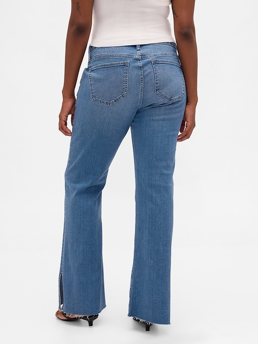 jeans a vita bassa lunghi e attillati con orlo diviso