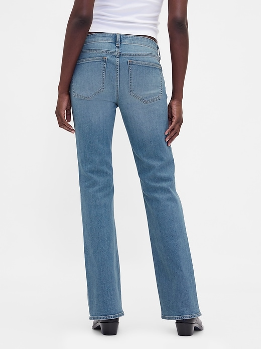 jeans lunghi e attillati con lacci a vita bassa