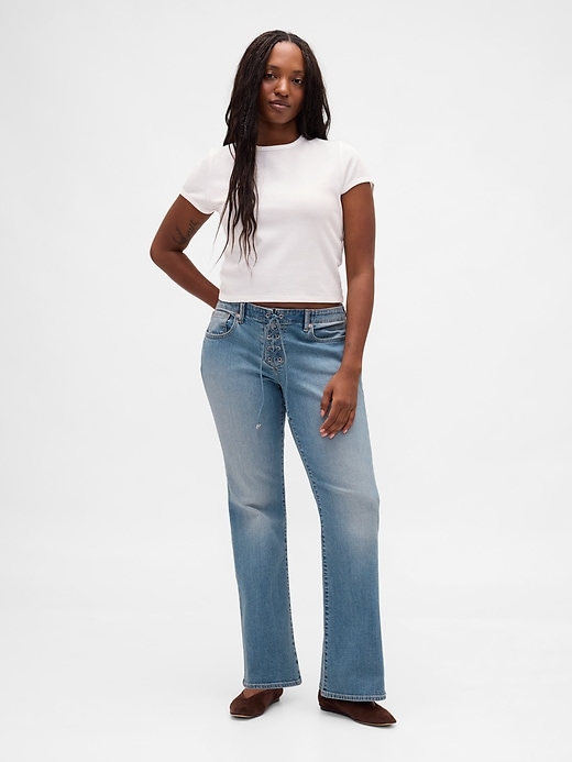 jeans lunghi e attillati con lacci a vita bassa