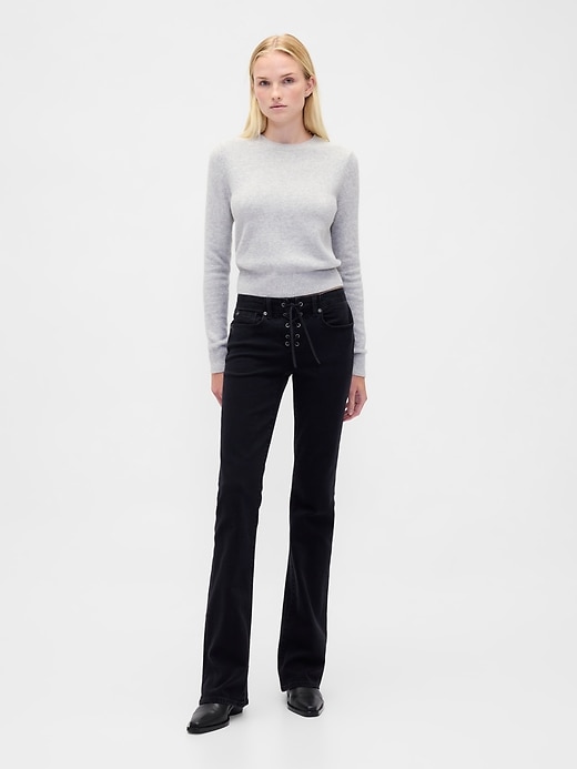 jeans lunghi e aderenti con lacci a vita bassa