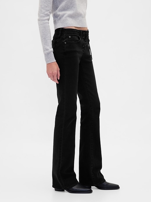 jeans lunghi e aderenti con lacci a vita bassa