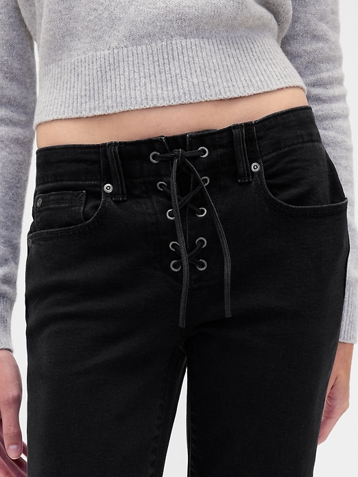 jeans lunghi e aderenti con lacci a vita bassa