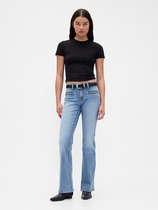 jeans lunghi e attillati con tasche intrecciate a vita bassa