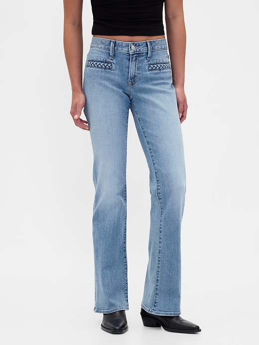 jeans lunghi e attillati con tasche intrecciate a vita bassa