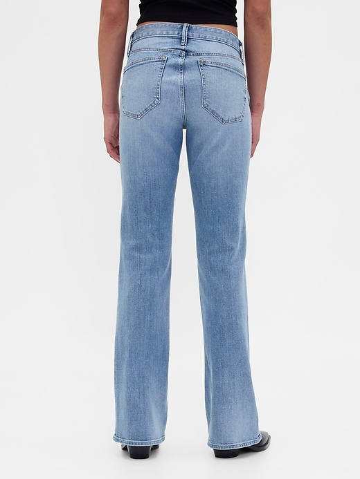 jeans lunghi e attillati con tasche intrecciate a vita bassa