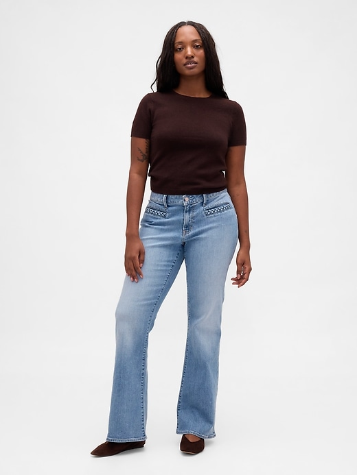 jeans lunghi e attillati con tasche intrecciate a vita bassa