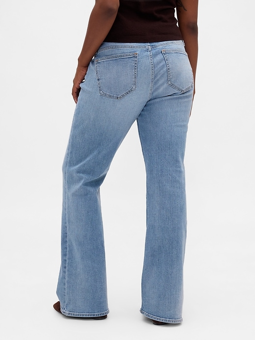 jeans lunghi e attillati con tasche intrecciate a vita bassa