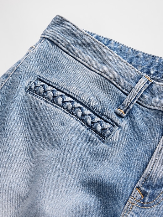 jeans lunghi e attillati con tasche intrecciate a vita bassa