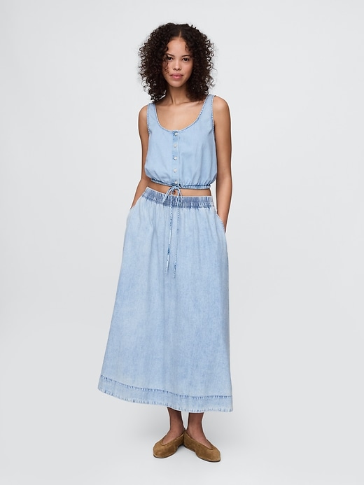 top corto in denim con orlo stretto