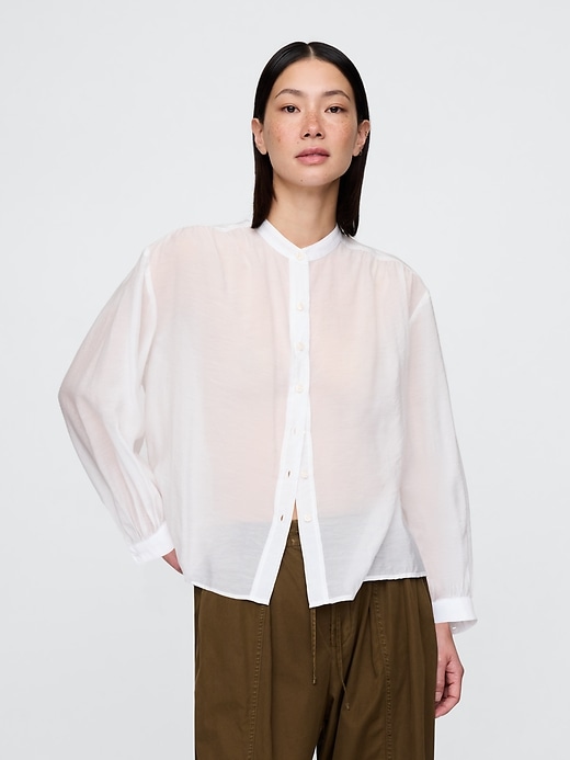 camicia trasparente con bottoni sul davanti