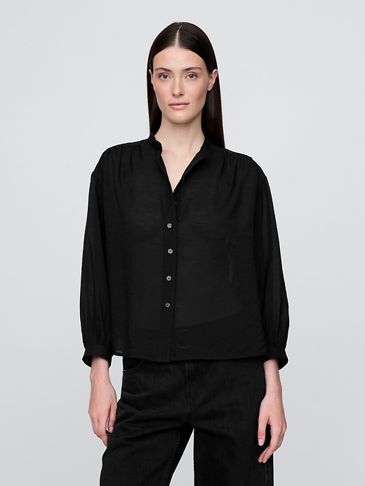 camicia trasparente con bottoni sul davanti