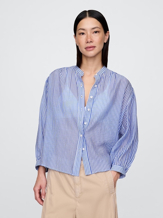 camicia trasparente con bottoni sul davanti
