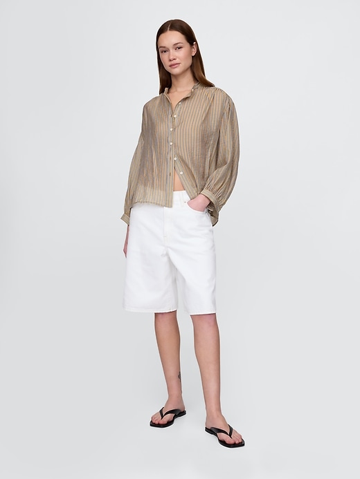 camicia trasparente con bottoni sul davanti