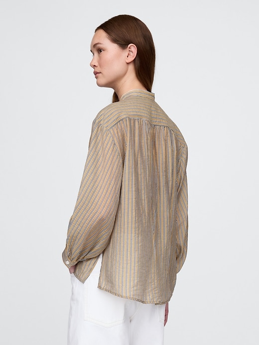 camicia trasparente con bottoni sul davanti