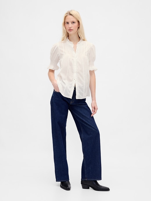 camicia con volant e pieghe
