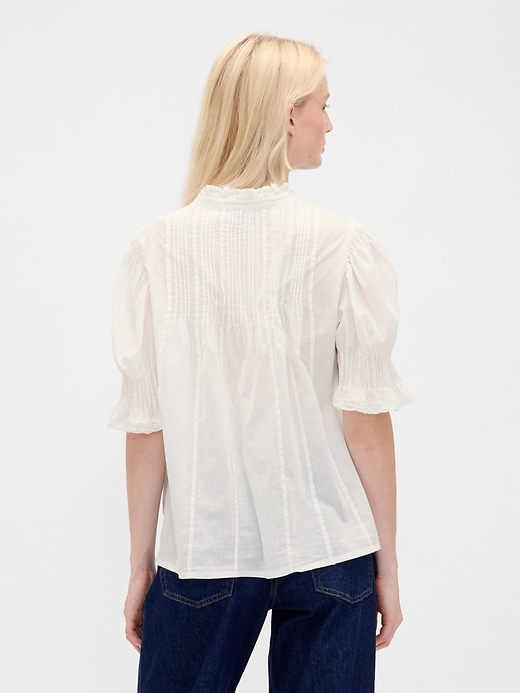 camicia con volant e pieghe