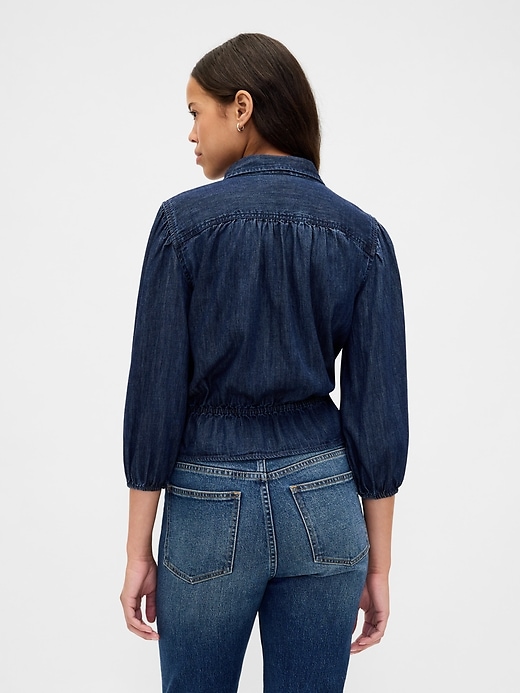 top in denim con cintura in vita