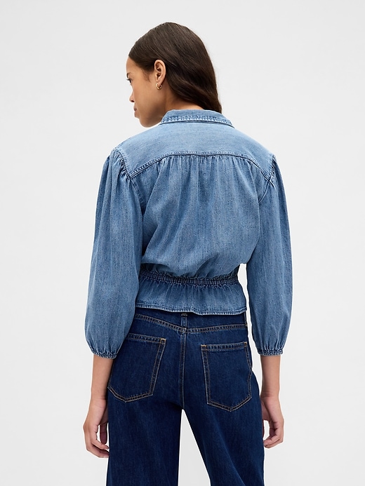 top in denim con cintura in vita
