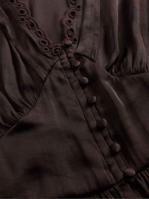 top peplo con scollo a v e occhielli