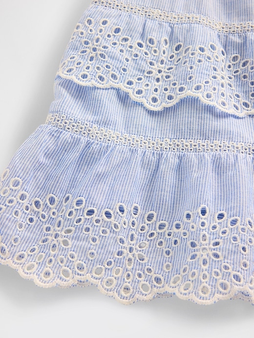 mini gonna-pantalone con volant e occhielli