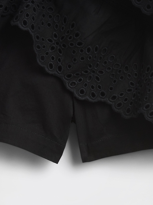 mini gonna-pantalone con volant e occhielli