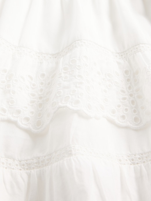 mini gonna-pantalone con volant e occhielli