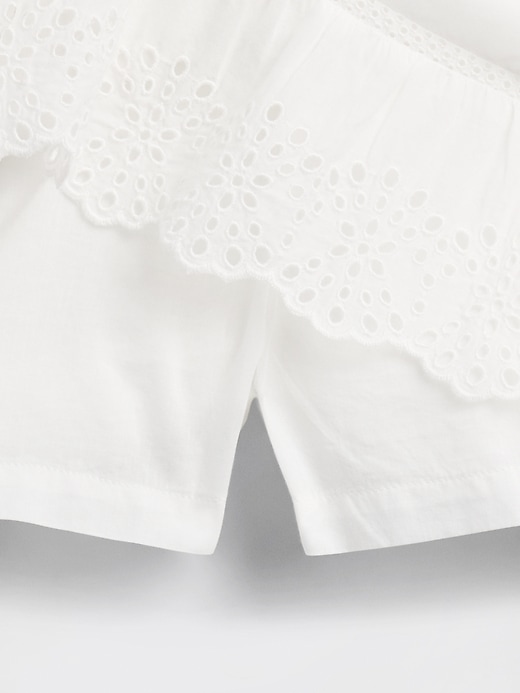 mini gonna-pantalone con volant e occhielli