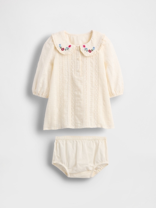 vestito ricamato per neonato