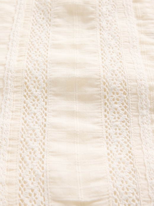 vestito ricamato per neonato
