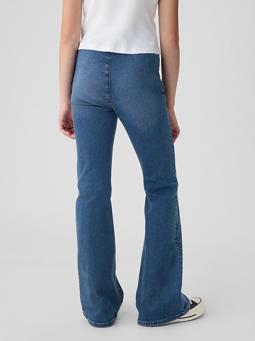 jeans a zampa incrociati a vita alta per bambini