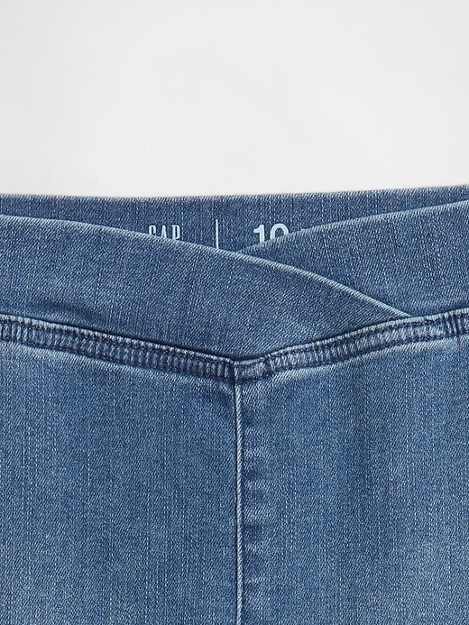 jeans a zampa incrociati a vita alta per bambini