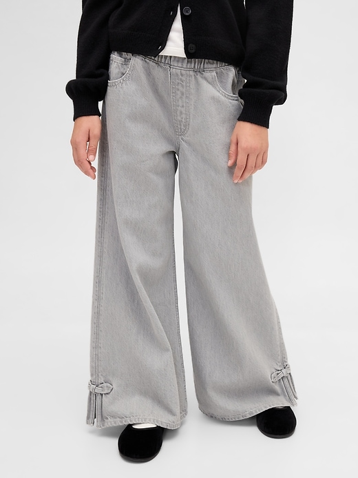 jeans larghi con orlo diviso e fiocco a vita bassa per bambini