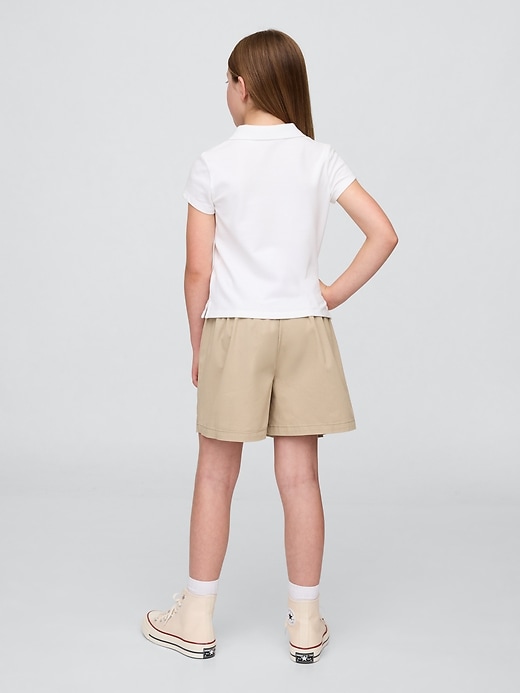 gonna-pantalone plissettata cachi per bambini modello uniforme