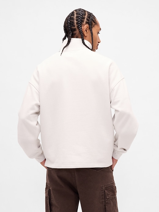 pullover pesante con mezza zip e logo oversize